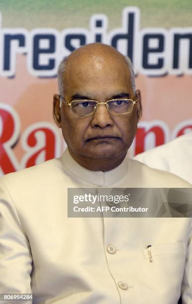 Indian National Democratic Alliance member and government candidate for the forthcoming presidential election Ram Nath Kovind looks on during a...