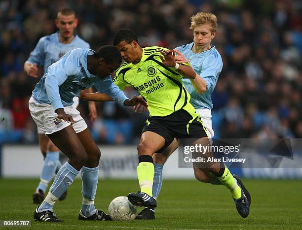 Jacob Mellis of Chelsea runs between Dedryck Boyata and Ben Mee of Manchester City on his way to scoring the opening goal during the FA Youth Cup...