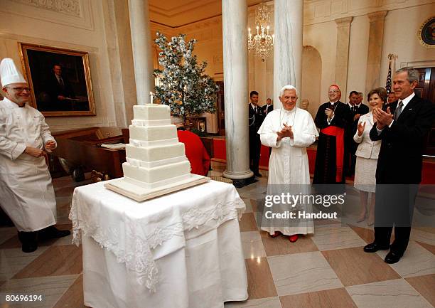 In this photo provided by the White House President George W. Bush and first lady Laura Bush lead the celebration of the 81st birthday of Pope...