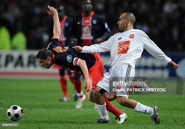 Carquefou's midfielder Loufti Zebidi vies with PSG's defender Sylvain Armand during the French cup quarter final football match Carquefou vs. PSG on...