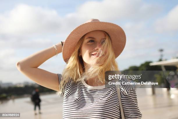 a young woman in paris - close up of beautiful young blonde woman with black hat stock pictures, royalty-free photos & images