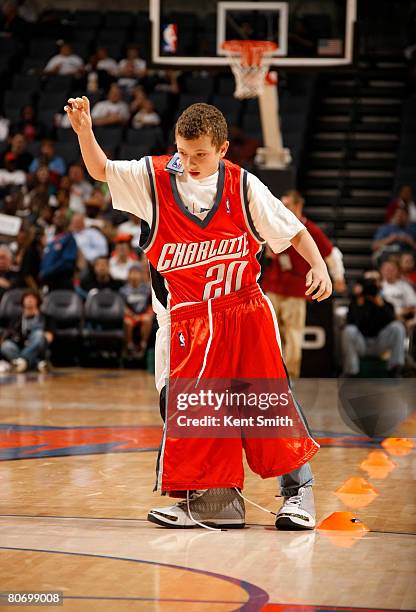 Young Charlotte Bobcats fan participates in a relay during thethe Charlotte Bobcats game against the Philadelphia 76ers on April 16, 2008 at the Time...