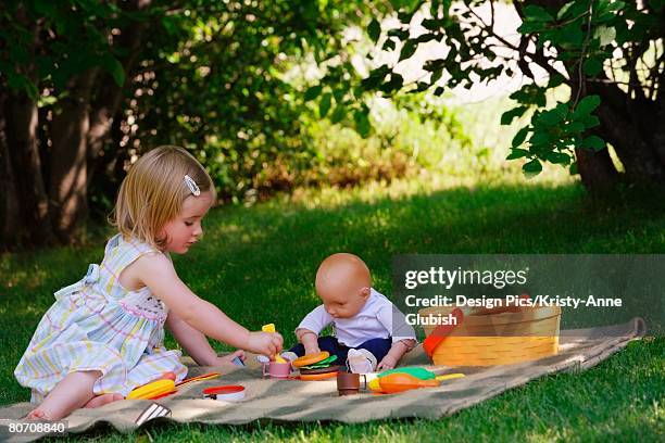 girl having a play picnic - winnipeg park stock pictures, royalty-free photos & images