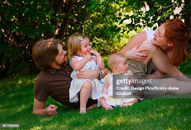 family playing together - winnipeg park stock pictures, royalty-free photos & images