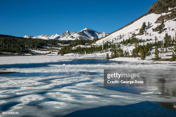 Still frozen Tioga Lake at the Highway 120 park entrance near Tioga Pass is viewed on June 28 near Lee Vining, California. Following a five-year...