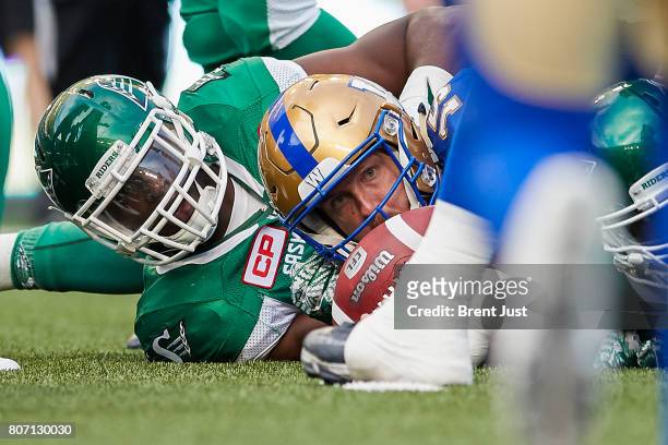 Matt Nichols of the Winnipeg Blue Bombers looks to see if he reached the first down marker after scrambling in the game between the Winnipeg Blue...