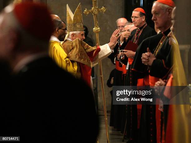 Pope Benedict XVI gestures after a private prayer service with 350 bishops of the United States at crypt church of the Basilica of the National...