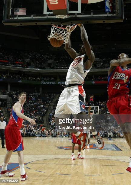 Emeka Okafor of the Charlotte Bobcats dunks against the Philadelphia 76ers on April 16, 2008 at the Time Warner Cable Arena in Charlotte, North...