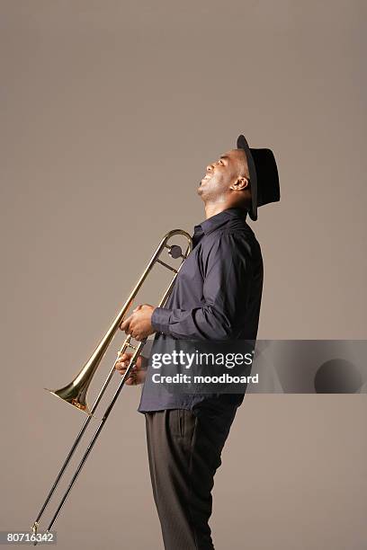 trombonist - trombone stock pictures, royalty-free photos & images