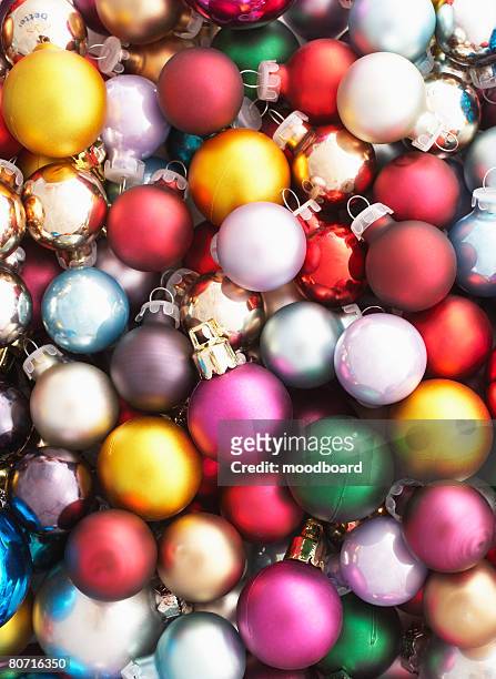 pile of christmas baubles full frame - pile of gifts stock pictures, royalty-free photos & images