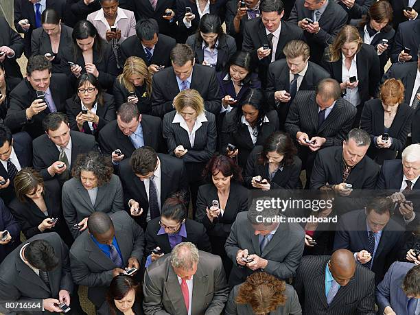 large group of business people text messaging elevated view - same person different looks stock pictures, royalty-free photos & images