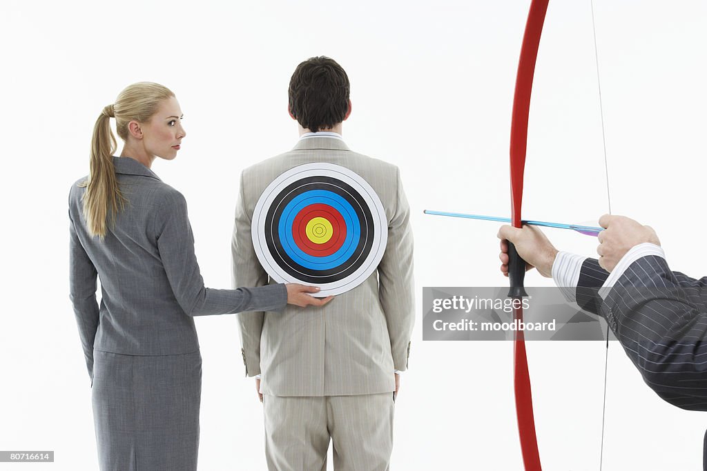 Businessman with Archery Target on His Back