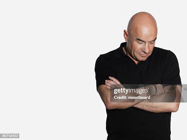 man with arms crossed - glatzenbildung stock-fotos und bilder