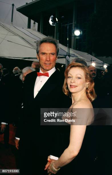 Actor Clint Eastwood and partner actress Frances Fisher attend the 65th Academy Awards Ceremony on March 29, 1993 at the at Shrine Auditorium in Los...