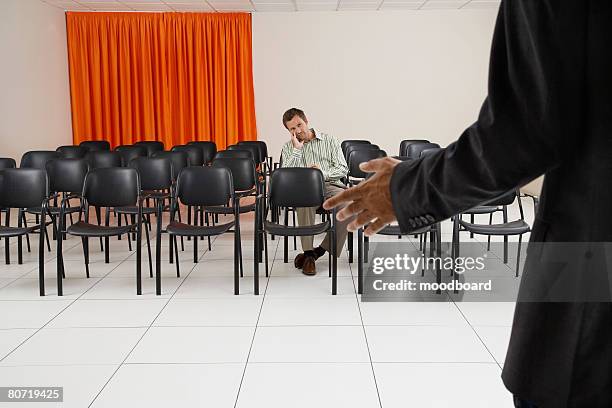 man listening to speech - bored audience stock pictures, royalty-free photos & images