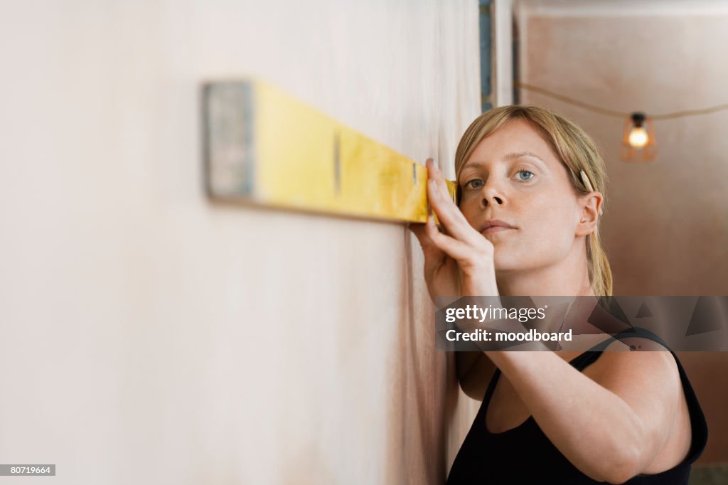 Woman Using Level High-Res Stock Photo - Getty Images