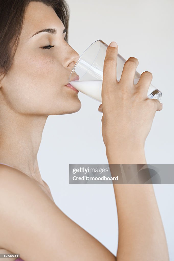 Young Woman Drinking Milk