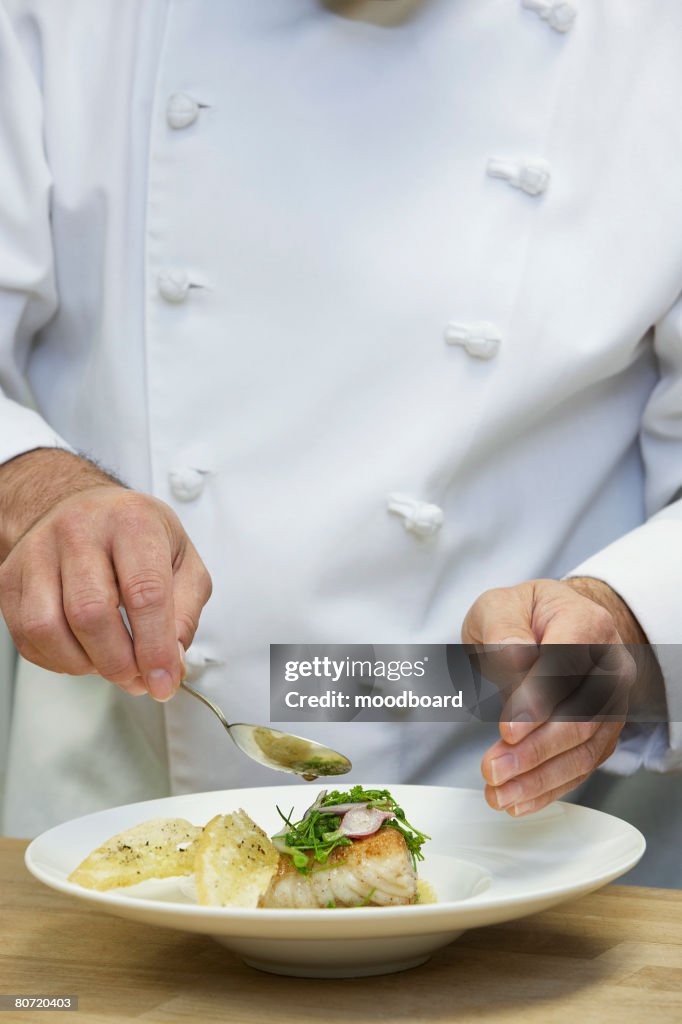Male chef preparing food close-up
