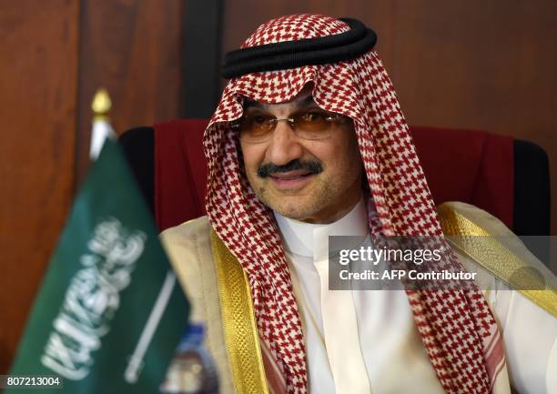 Saudi Arabian royal Al-Waleed Bin Talal bin Abdulaziz al Saud looks on during a meeting with Sri Lankan Foreign Minister Ravi Karunanayake in Colombo...