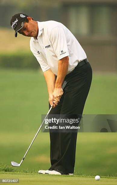 David Howell of England in action on the 18th green during the first round of the Volvo China Open at the Beijing CBD International Golf Club on...