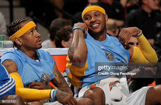 Allen Iverson and Carmelo Anthony of the Denver Nuggets check out of the game in the third quarter against the Memphis Grizzlies at the Pepsi Center...