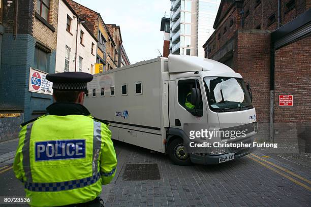 Prison van believed to contain the 17-year-old teenager accused of murdering schoolboy Rhys Jones arrives under police escort at Liverpool...