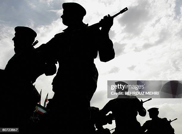 Iranian soldiers march past Iranian President Mahmoud Ahmadinejad during the annual army day military parade in Tehran on April 17, 2008. Ahmadinejad...