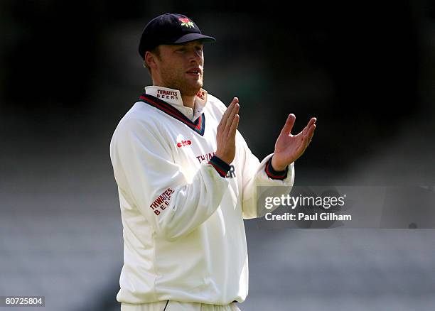 Andrew Flintoff of Lancashire applauds a team-mate during day two of four of the LV County Championship Division One match between Surrey and...