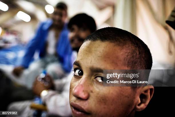 Injured Afghan child Mohamed Gul is seen as he recovers in his hospital bed at the ward 1 on June 8, 2007 at the British Army Field Hospital at Camp...