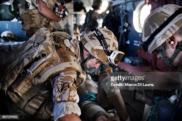 British Army Anaesthetist Lt. Col. Ian Hicks and British Army Medical Emergency Response team Sgt. Gavin Carr from the UK Med Group attend injured...