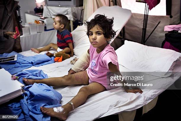 Malalia is seen as she recovers in her hospital bed on June 9, 2007 at the British Army Field Hospital at Camp Bastion in a location in the desert in...