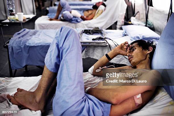Injured Afghan National Police Officer Abdullah is seen as he recovers in his hospital bed at the ward 2 on June 8, 2007 at the British Army Field...