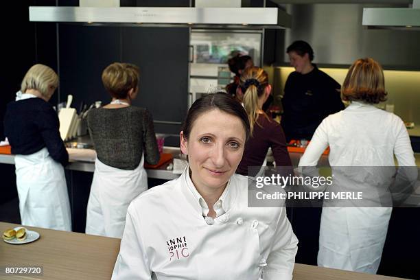 French chef Anne-Sophie Pic poses on the opening of her cookery school called Scook next door to her famous restaurant in the southern town of...