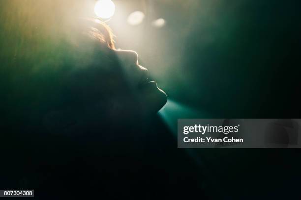 Silhouette of a woman's face shot during a concert in New York.