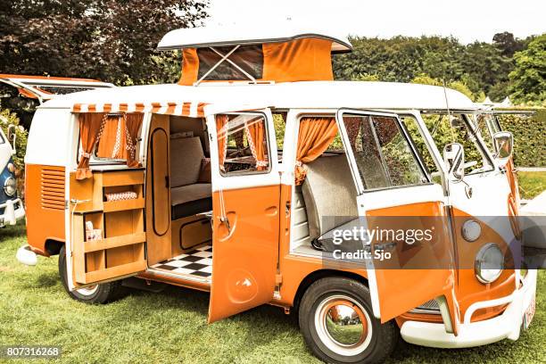 volkswagen transporter t1 camper van in a park - vw kombi stock pictures, royalty-free photos & images
