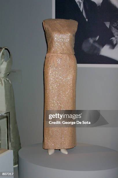 Emblematic of modern Western luxury and sophistication, this shell pink silk-georgette chiffon, sequin-embroidered evening dress by Oleg Cassini was...