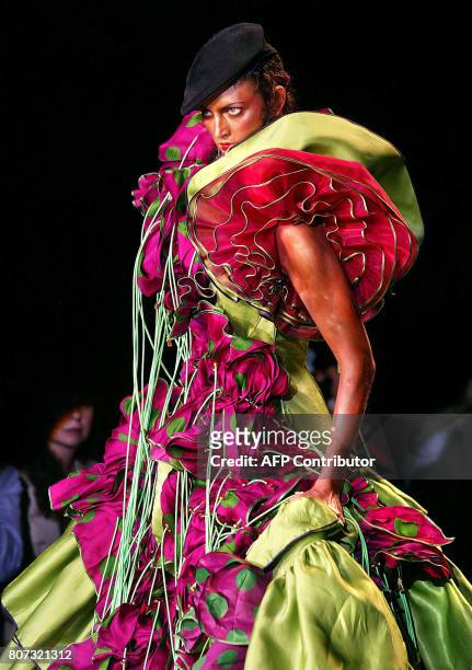 Model presents a creation by British designer John Galliano for Christian Dior 07 July 2003 during the autumn-winter 2003/04 haute couture...