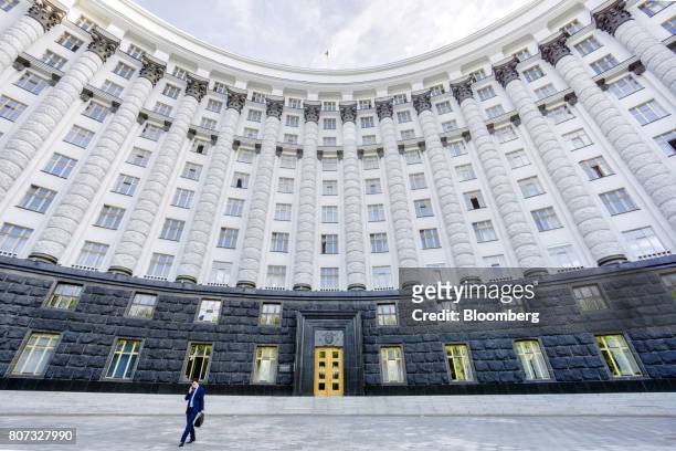 Worker leaves the the cabinet of ministers building in Kiev, Ukraine, on Monday, July 3, 2017. The next transfer of Ukraines $17.5 billion...