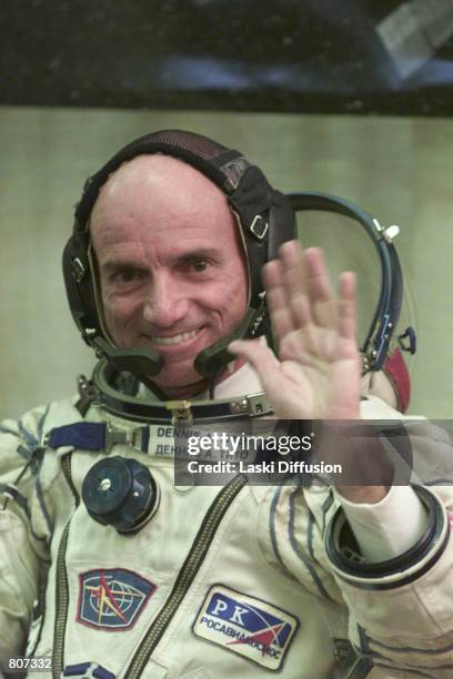 Dennis Tito, the world's first space tourist, waves before boarding the Soyuz TM-32 spaceship April 28, 2001 at the Baikonur cosmodrome in...