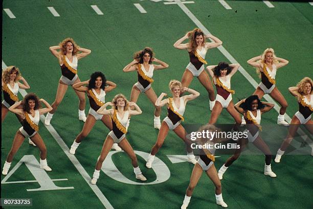 The Washington Redskins cheerleaders cheer during a timeout against the Buffalo Bills in Super Bowl XXVI at the Metrodome on January 26, 1992 in...