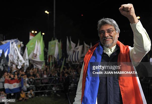 Former Catholic bishop and Paraguayan presidential candidate for the Patriotic Alliance for Change party Fernando Lugo puts his fist up in Asuncion...