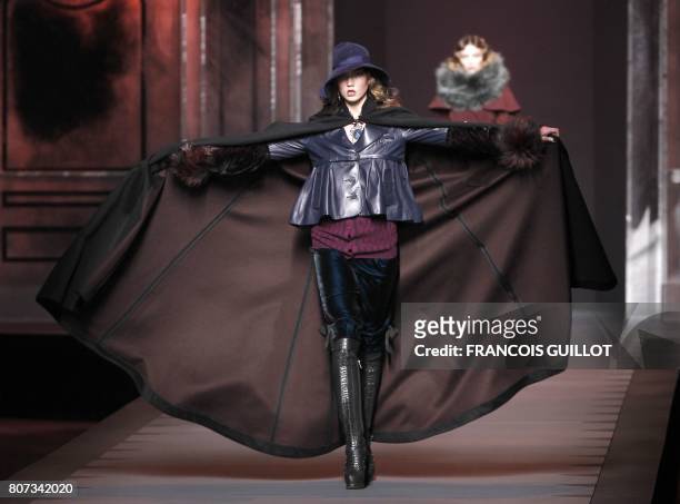 Model Karlie Kloss presents a creation by British designer John Galliano for Christian Dior during the Autumn/Winter 2011-2012 ready-to-wear...