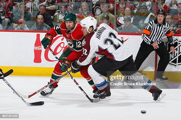 During Game Five of the Western Conference Quarter-Final of the Stanley Cup Playoffs Brian Rolston of the Minnesota Wild and Scott Hannan of the...