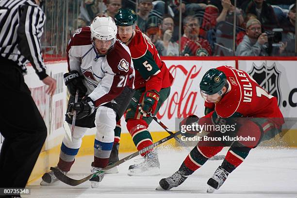 During Game Five of the Western Conference Quarter-Final of the Stanley Cup Playoffs Kim Johnsson and Stephane Veilleux of the Minnesota Wild attempt...