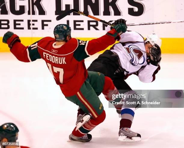 Todd Fedoruk of the Minnesota Wild and Peter Forsberg of the Colorado Avalanche collide during game five of the 2008 NHL Western Conference...