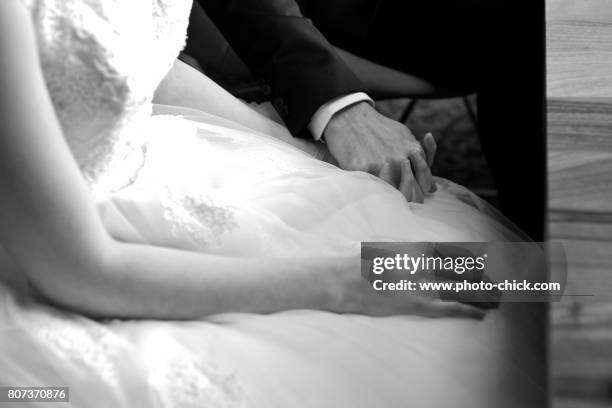 a picture of bride and groom holding hands - hochzeitskleid bildbanksfoton och bilder