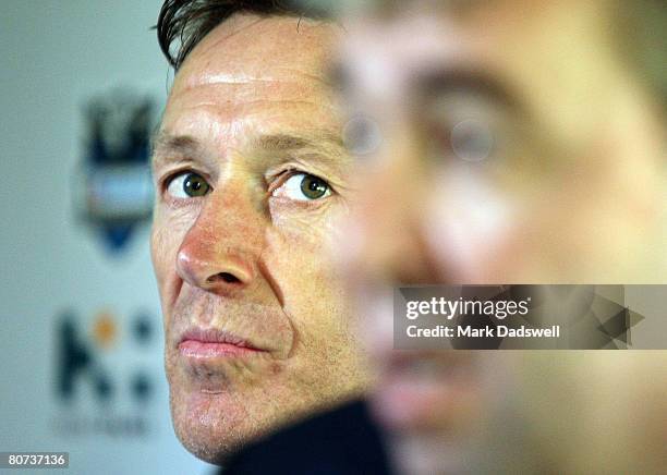 Storm coach Craig Bellamy looks on as Storm CEO Brian Waldron announces Bellamy has signed on for another five years at a press conference at the...