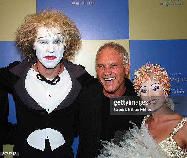 Artist Richard MacDonald appears with Cirque du Soleil performers during the grand opening reception for The Art of Richard MacDonald presented by...