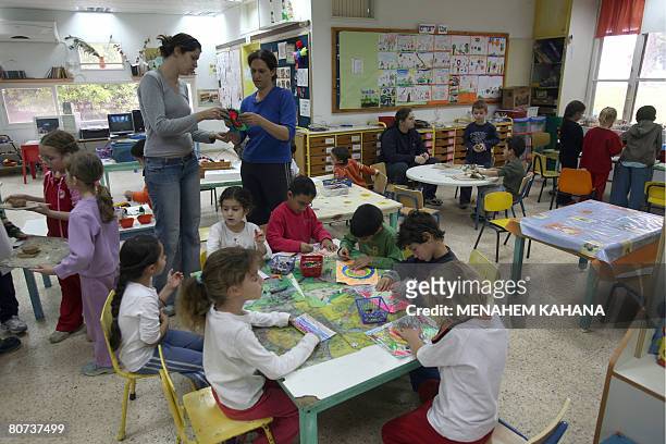 Israeli children attend at class at a kindergarten in Israel's oldest kibbutz, Deganya Alef, on the shores of the Sea of Galile on April 1, 2008. The...