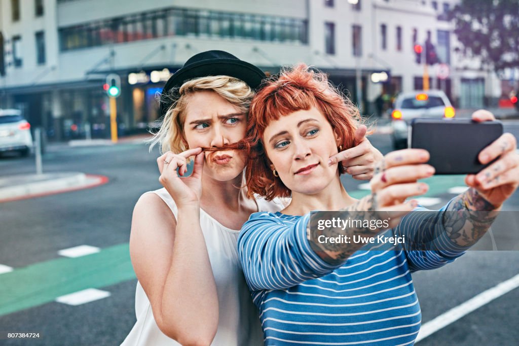 Two young women taking self portrait